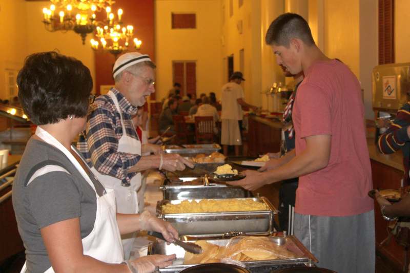 a group of people serving food