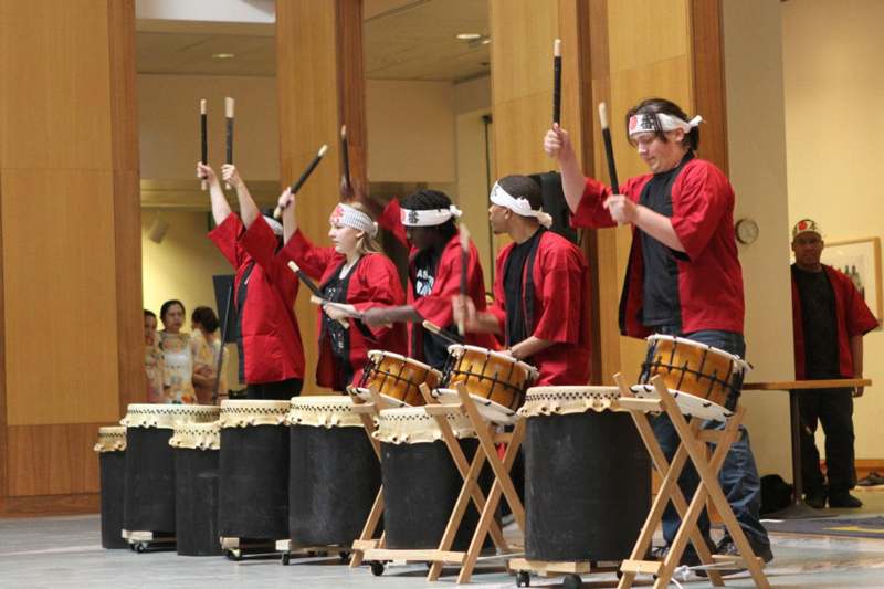 a group of people playing drums