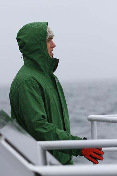 a man in a green jacket