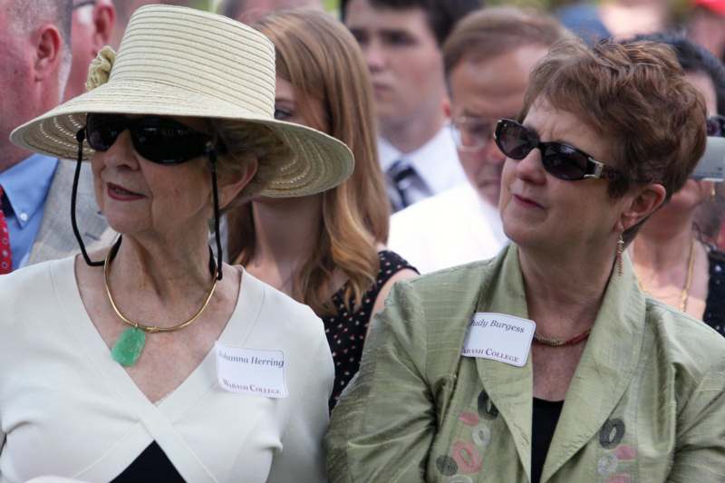 a group of women wearing sunglasses and hats