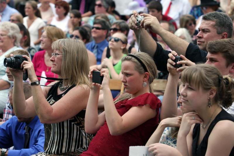 a group of people taking pictures