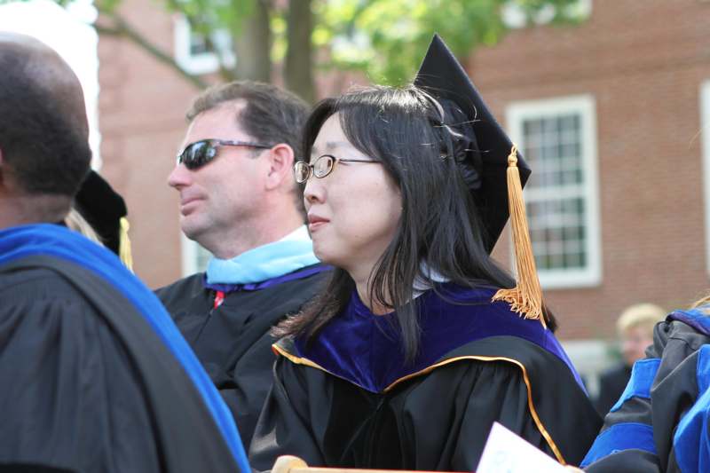 a woman wearing a graduation gown