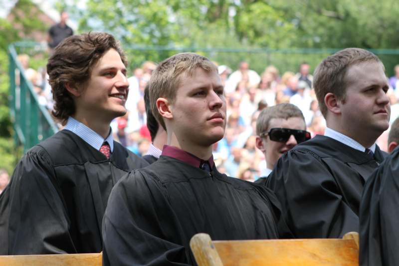 a group of men wearing black robes
