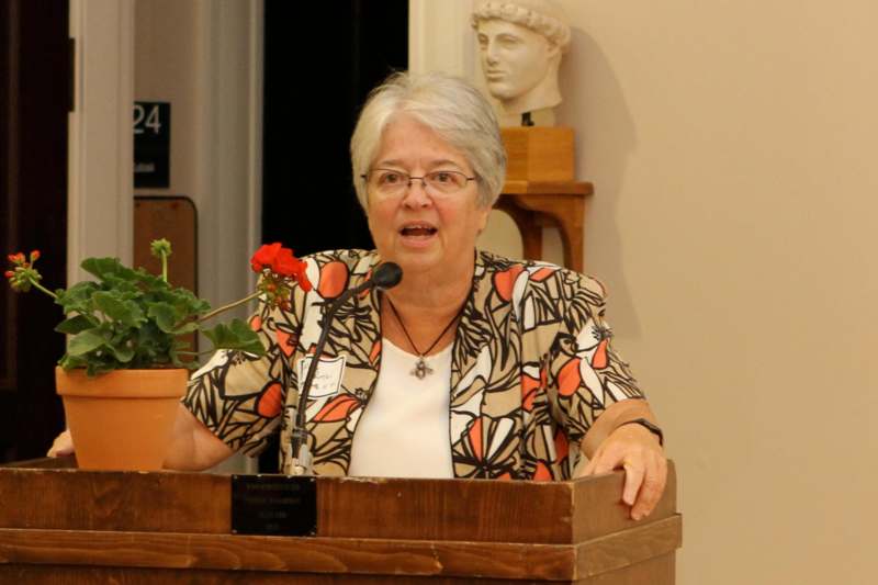 a woman speaking at a podium