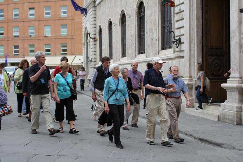 a group of people walking on a street