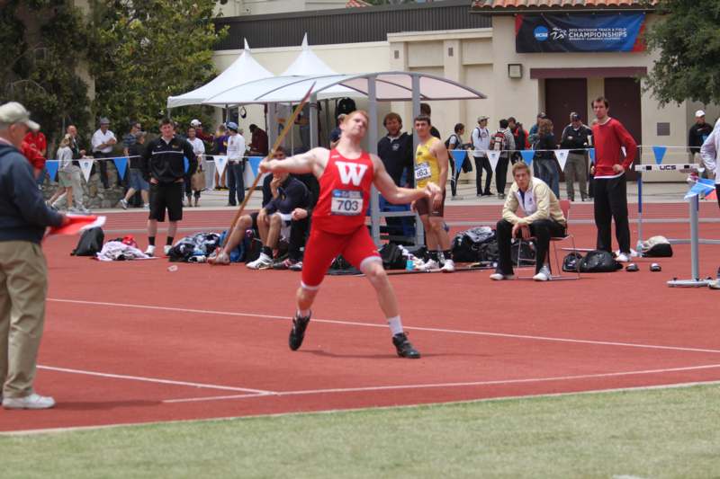 a man throwing a javelin
