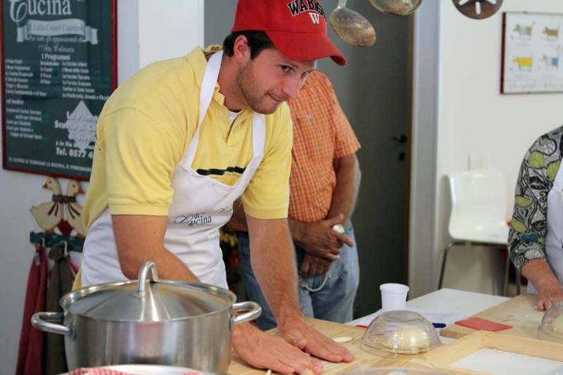 a man in a red hat and apron