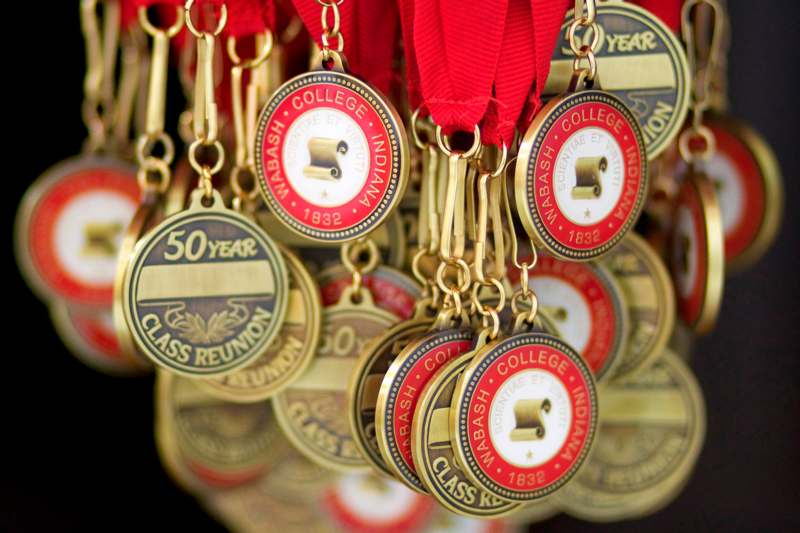 a group of medals with red ribbons