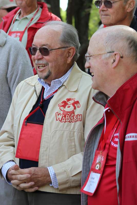a group of men wearing red jackets