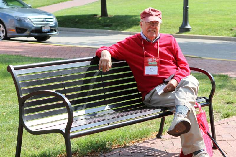 a man sitting on a bench