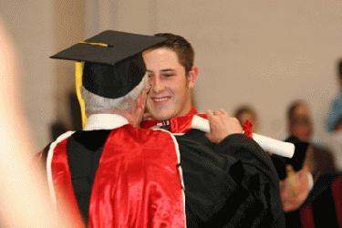 a man hugging a graduate