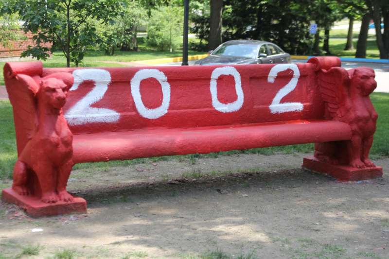a red bench with numbers painted on it
