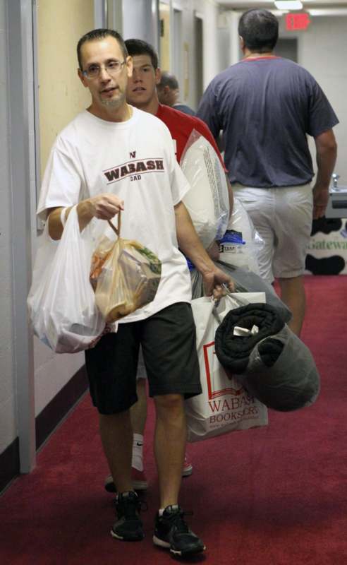 a man carrying bags of food