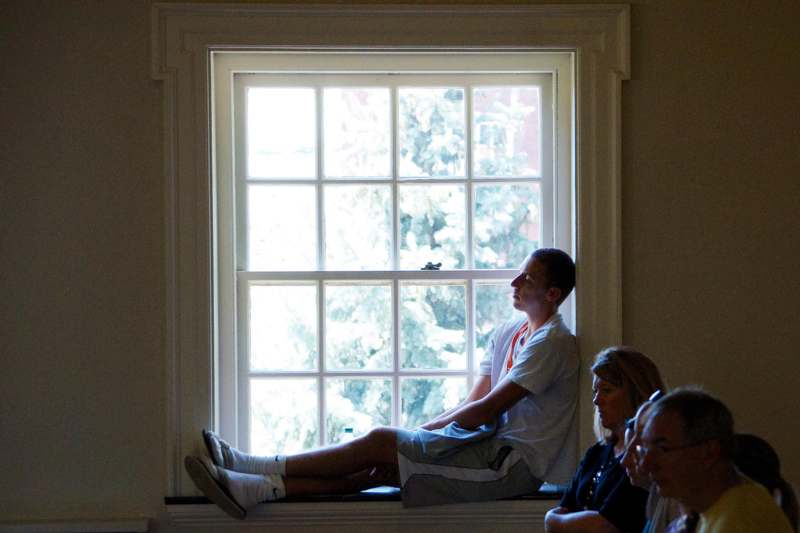 a group of people sitting in a window