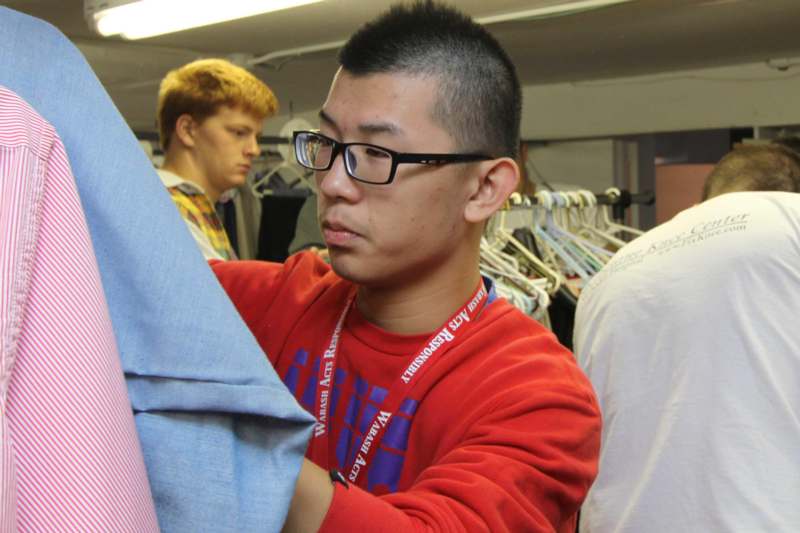 a man looking at clothes