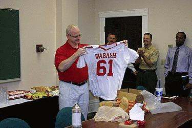 a man holding a jersey