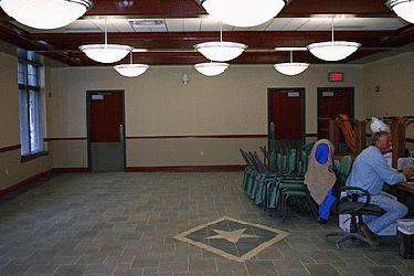 a room with chairs and lights