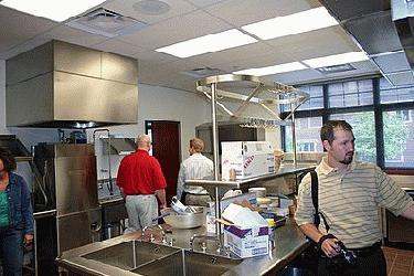 a group of people in a kitchen
