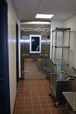 a metal door in a room