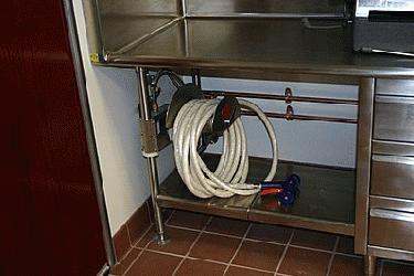 a pipe on a metal shelf
