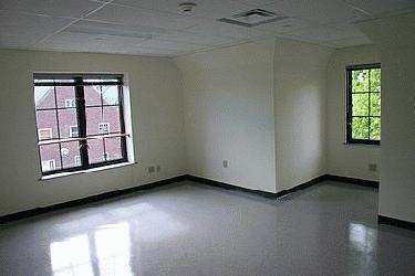 a room with a window and a couple of windows