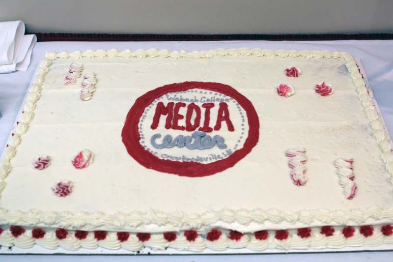 a cake with a red and grey logo