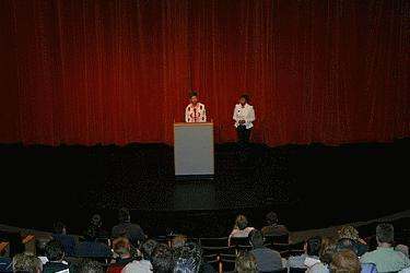 a group of people standing on a stage