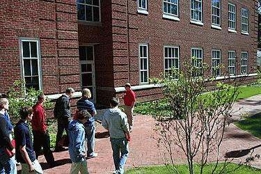 a group of people walking outside a building