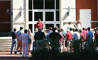 a group of people standing outside a building