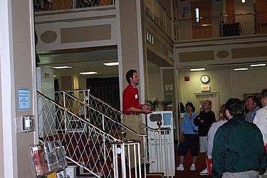 a man standing in front of a staircase