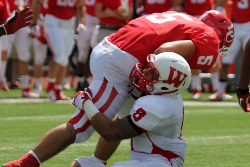 a football player in a red uniform