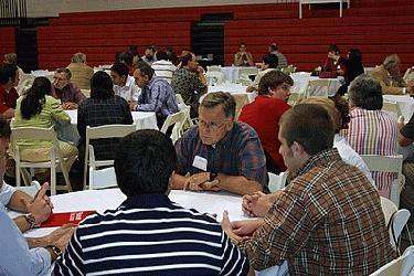 a group of people sitting at tables