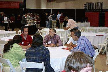 a group of people sitting at tables