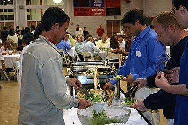 a group of people serving food