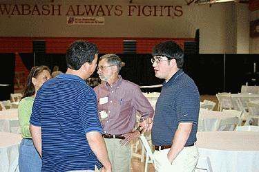 a group of men talking to each other