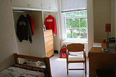 a bedroom with a closet and a chair