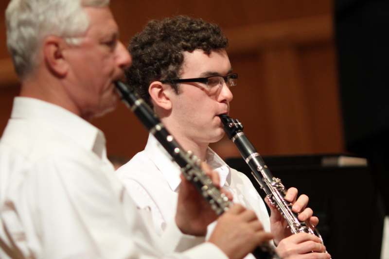 a man playing a clarinet