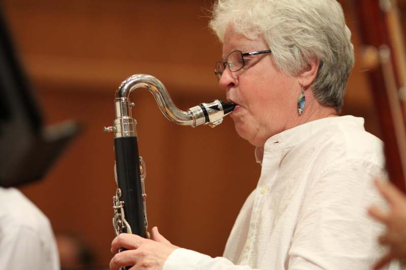 a woman playing a clarinet