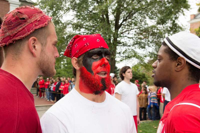 a group of men with face paint