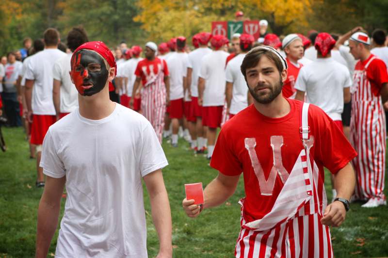 a group of men wearing red and white outfits