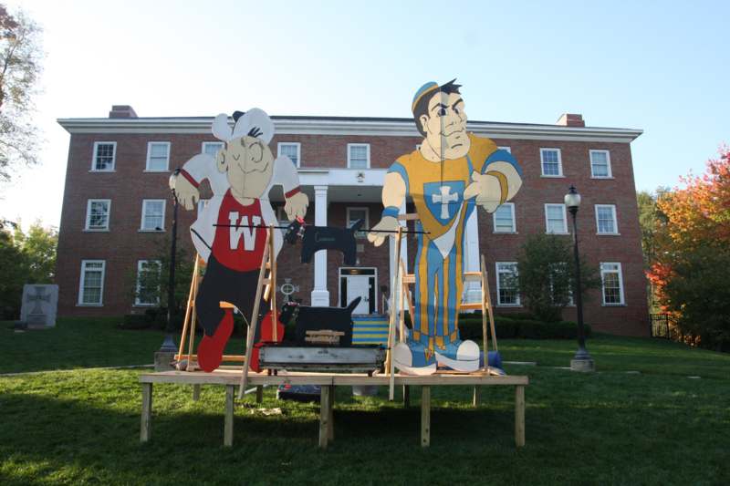 a large cardboard cutouts of cartoon characters outside of a building