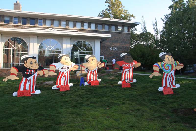 a group of cartoon characters in a yard
