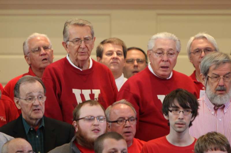 a group of men wearing red shirts