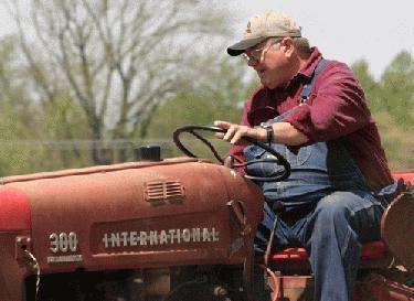 a man driving a tractor