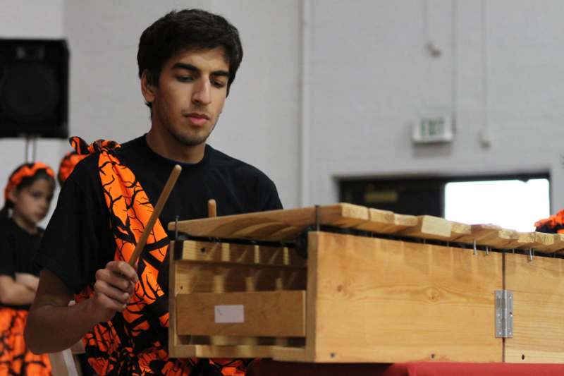 a man playing a xylophone