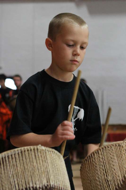 a boy playing drums