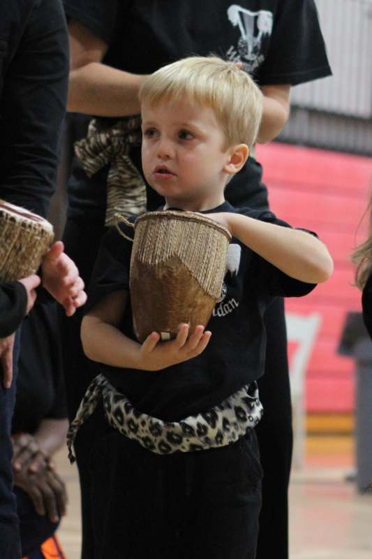a child holding a basket