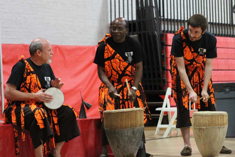 a group of men playing drums