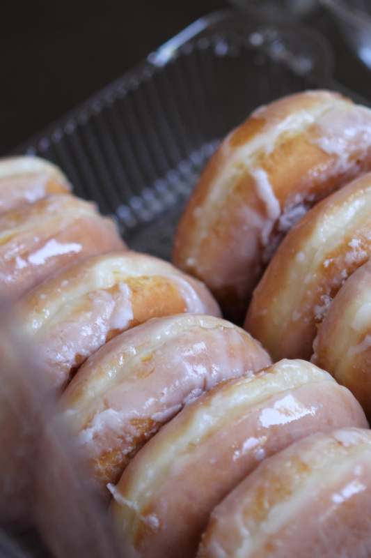 a group of glazed donuts