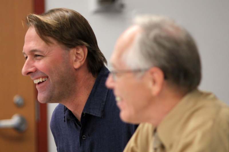 a close-up of men laughing
